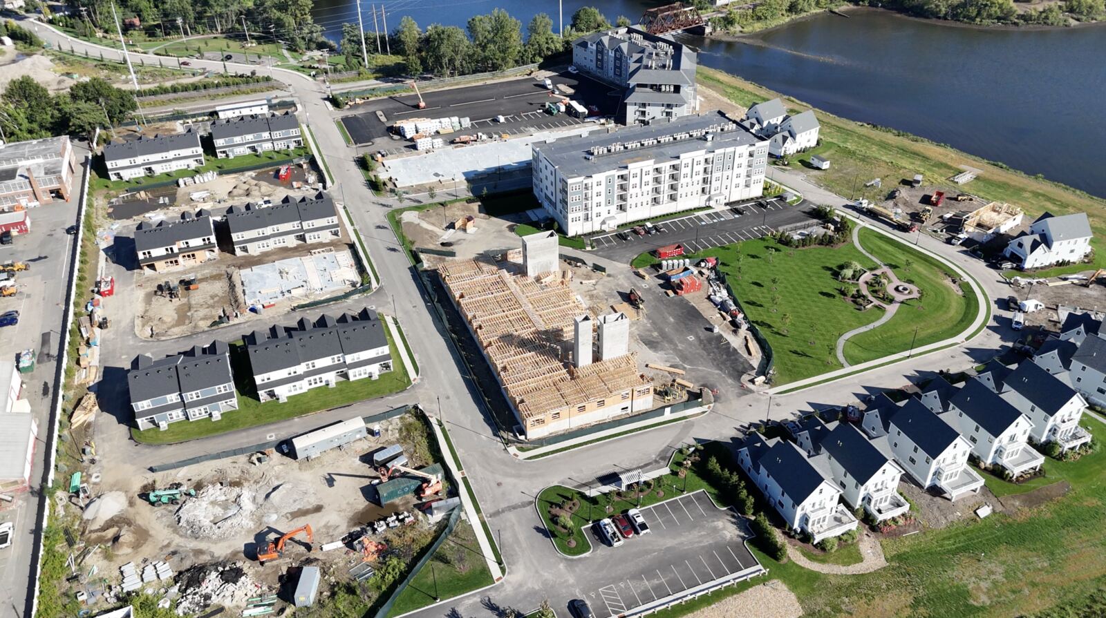 Aerial view of the whole East Point campus — the apartment buildings, townhomes, condominiums and the central green