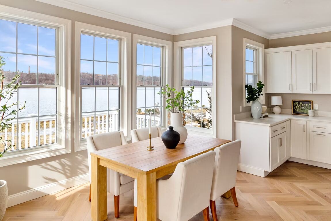 The dining room sits in a bay over the water